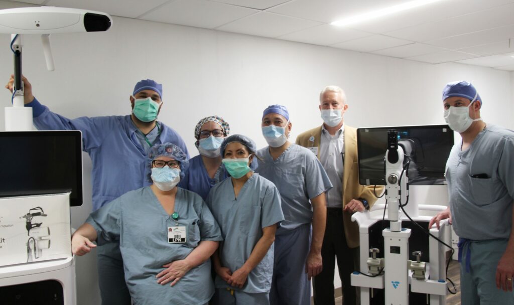 medical providers in operating room with robotics community memorial hospital