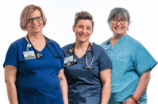 Three healthcare providers smiling