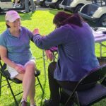 Blood pressure check at golf tournament fundraiser for Community Memorial Hospital