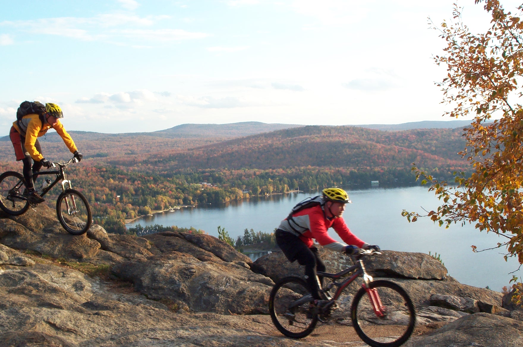 Two people mountain biking in the mountains of new york