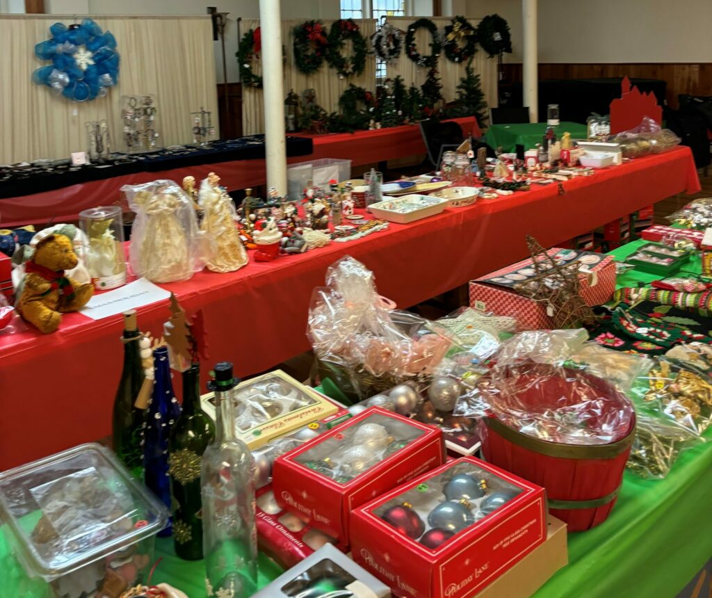 Holiday Sale fundraiser tables with holiday items on display for sale.