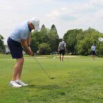 Man chipping onto the green