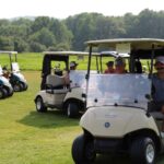 Golfers in golf carts