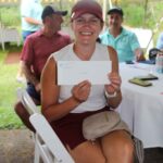 Smiling woman holding an envelope