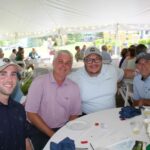 Four golfers getting at banquet table