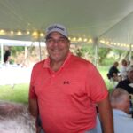 Smiling man at golf tournament