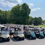 Rows of golf carts getting ready for a tournament