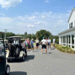 Golfers getting ready for a fund raiser tournament