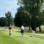 Two men golfing