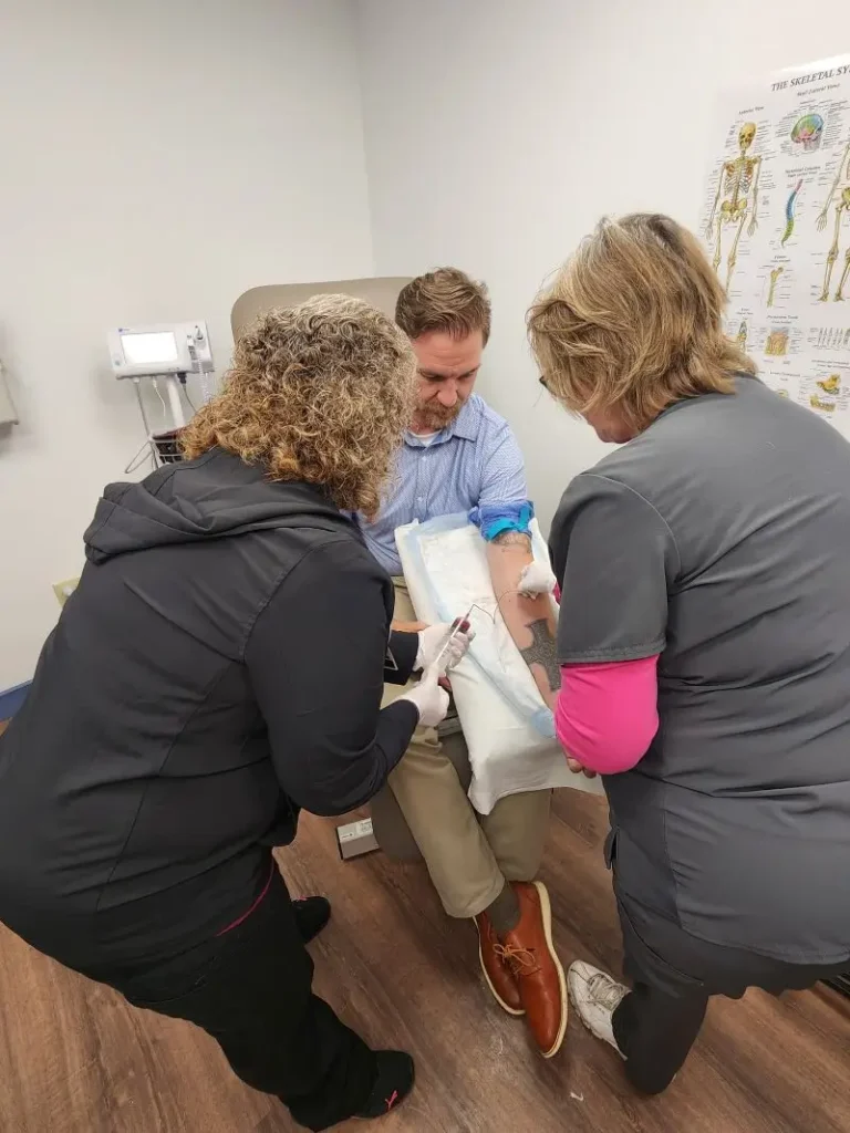 patient receiving treatment from two care providers