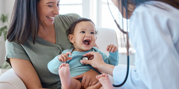 Pediatric doctor caring for baby